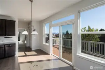 Access to rear deck and sun drenched backyard