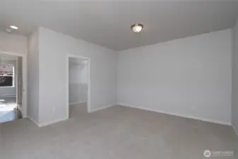 Extra large primary bedroom with walk-in closet