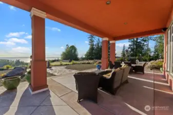Covered patio with outdoor kitchen area off of the great room for enjoying the westerly water views and sunsets