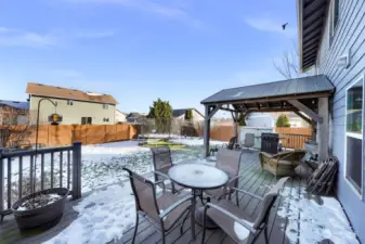 Off the dining room, a spacious, partially covered deck provides the perfect setting for entertaining.