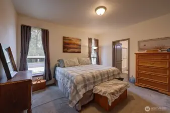 Primary bedroom with full bath and walk in closet.