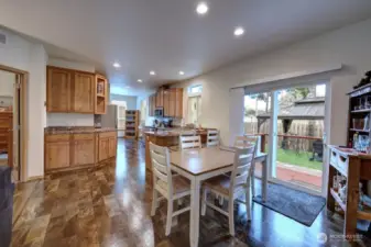 Dining room, kitchen and sliding door to the fully fenced back yard.
