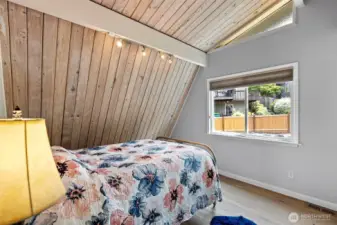 Every room tells a story. This bedroom is rich with character and warmth, offering a quiet retreat after lakeside adventures.