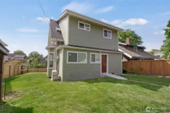 Look at the spacious yard! Perfect for summertime BBQs and ample parking via alleyway.