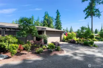 Clubhouse Point has a quiet private drive, perfect for those who travel.   The entrance to the home is between the Casita and the 2 car garage