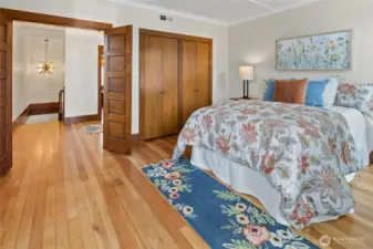 Elegant double doors open to the spacious primary bedroom.