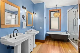 The upstairs bathroom is simply stunning, anchored by an original-style clawfoot tub that adds classic beauty and old-world charm.”