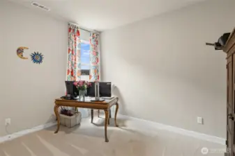 Main level guest bedroom or dedicated office space.