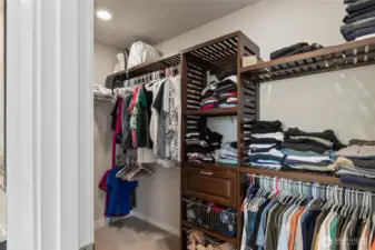 Walk in closet located off of primary bathroom