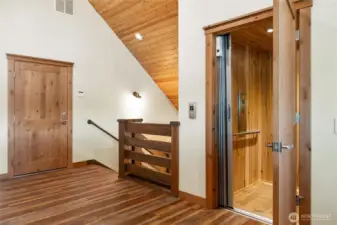 Eleveator located next to upper level garage entrance