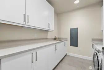 Storage galore in the utility room. Washer and dryer included!