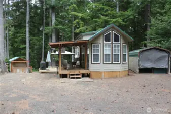 Home, deck, carport and new shed in the distance.