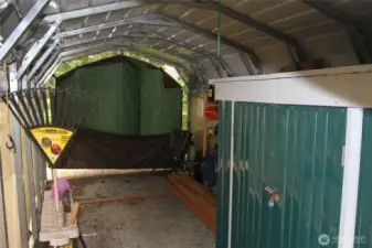 Interior of the carport showing metal storage
