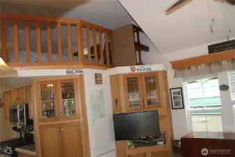 Last of the living room with a bit of kitchen view.