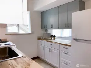 The kitchen has plenty of cabinet and counter space with a serve through for the dining room.