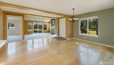 Looking back towards the light filled dining and living areas. The entrance to the Primary Bedroom is to the left.
