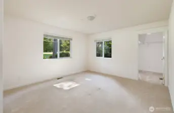 The guest bedroom includes a massive walk-in closet.