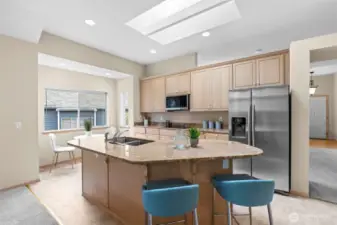 The heart of the home! This chef's kitchen is equipped with modern appliances, ample counter space, and a center island, ideal for cooking and entertaining.