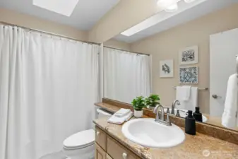 Conveniently located bathrooms offer both elegance and practicality for every floor. (Virtually Staged )