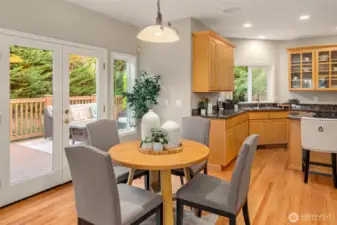 Eat-in kitchen provides access to the deck, which is a nice extension of the living and dining spaces.