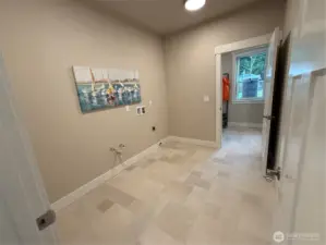 Large laundry room accessed from mud room or main living hall