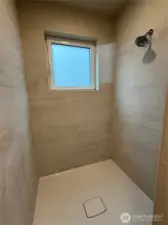 Primary fully tiled shower