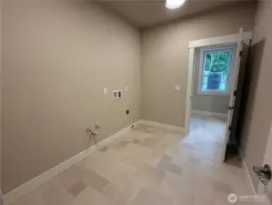 Large laundry room with room for extra storage or cabinetry