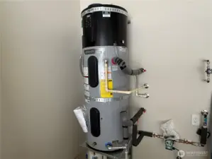 Garage with keyless entry, insulated garage doors, wired for generator and car charging station.