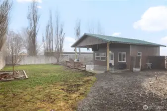 Rear of detached garage with outside living area