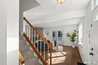 The perfect first impression - a sun-drenched foyer and beautiful, warm hardwood floors.