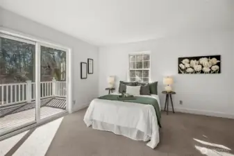 his spacious primary bedroom is fitted for those who love a bit of fresh air.