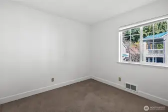 Light and airy, this third bedroom carries the home's trend of ample natural lighting.