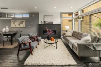 The living room is centered around the beautiful gas fireplace with custom tile surround. Behind the picture you'll find cable and electrical outlets for your TV.