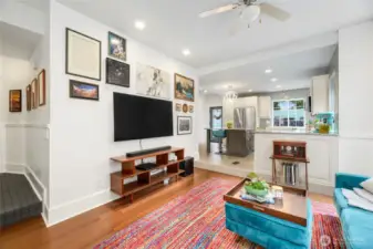 The open lay out makes for an inviting atmosphere in the living room. There is a gas fireplace flanked by tall and deep storage cabinets for media and entertainment storage.There an abundance of windows and natrual light.