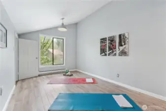 Bedroom on upper level-staged as yoga room.  Can be an office or play room.