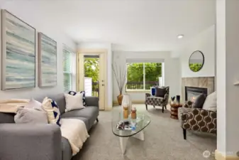 The 2nd floor is where the gathering happens. Spacious living room with gas fireplace and private patio with peek Mt. Rainier views