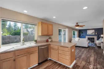 coming into the kitchen from the dining area, lots of windows for lots of natural light.