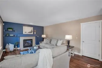 Family room with gas fireplace end entry to the garage.
