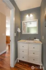 Hallway 1/2 bath just off of the kitchen/family room.