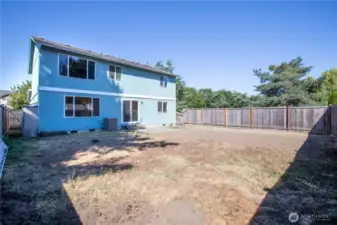 Fully fenced, and also has an out building.