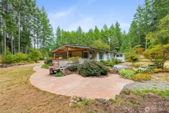 Side of home featuring wrap around deck and