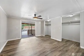 Primary Bedroom with sling door out to covered wrap around deck