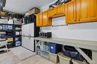 The garage has lots of storage and workshop space.