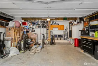 2 car garage with workshop area at the back and side.