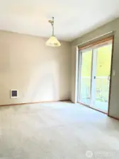 dining space off kitchen opens to balcony