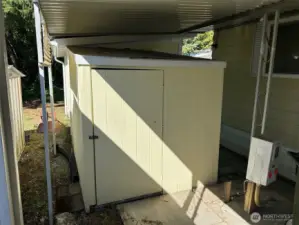 Secure storage shed under car port