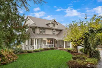Front view of home, wonderful wrap around porch and covered walk way.