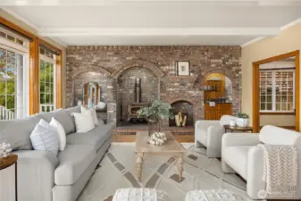 Great family rm with hardwood floors, full wall of brick with wood stove and wet bar.