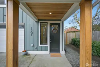 Covered entry porch with beautiful natural wood accents