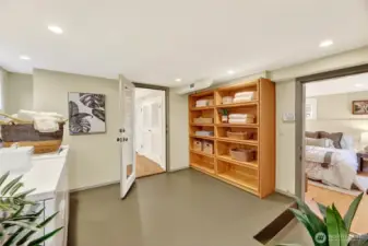 Laundry room with lots of built in storage and a utility sink.
